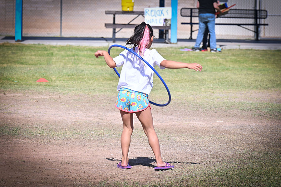 A girl hula hoops