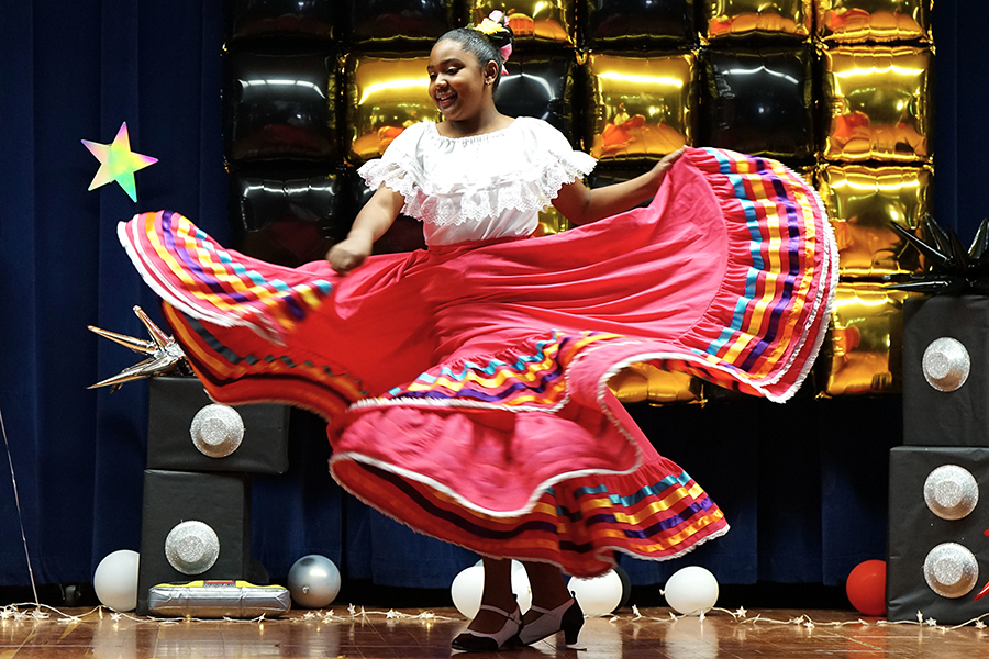 A girl dances in a folklorico dress